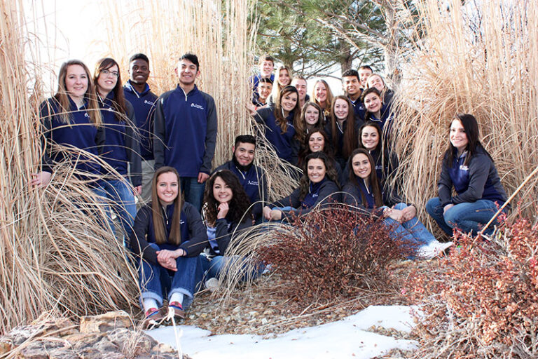 PLP students posing in winter foliage