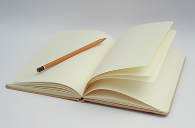 Open notebook with pencil